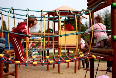 Kids playing on playground equipment